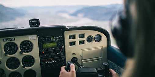 plane cockpit with person steering